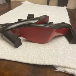 Nice patent shoes. Bottoms are Red. Size 41.